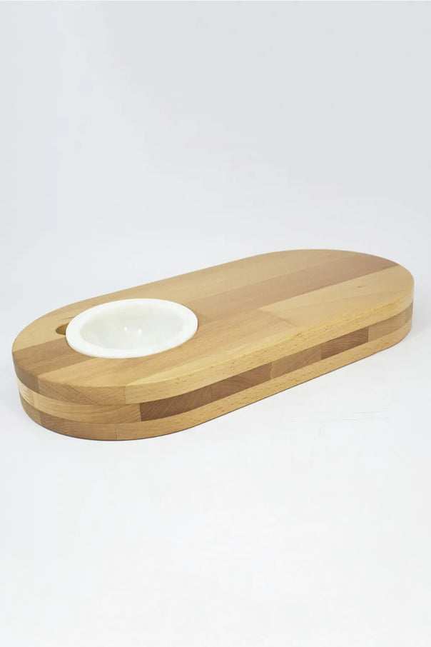 wooden cutting board with white marble bowl